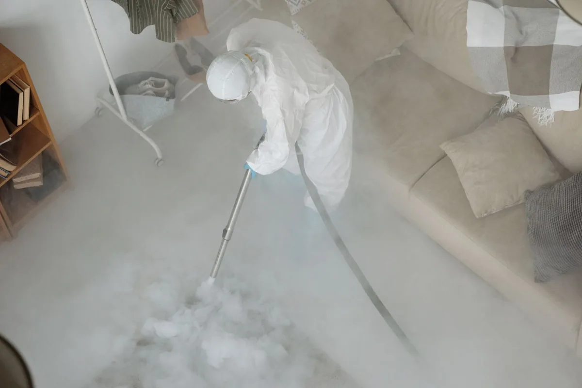 Biohazard cleanup technician in protective equipment, Winton, CA